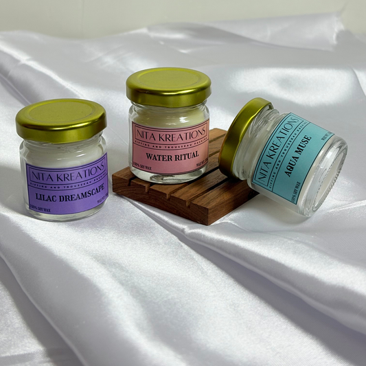 Pack of 3 mini soy wax candles in amber jars featuring Aqua Muse, Water Ritual, and Lilac Dreamscape fragrances, named Light Over Santorini.