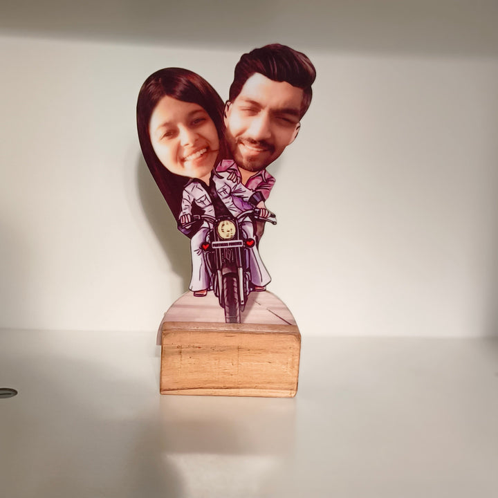 Cute caricature of a smiling couple riding a motorcycle, with their real faces on illustrated cartoon bodies wearing matching outfits, labeled “Partners Forever.” Caricature, gifting ideas, personalized gifting, custom gifts, couple gift, anniversary gift