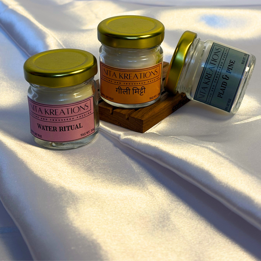 Pack of 3 mini soy wax candles in amber jars featuring Gilli Mitti, Plaid & Pine and Water Ritual fragrances, named After the Rain.