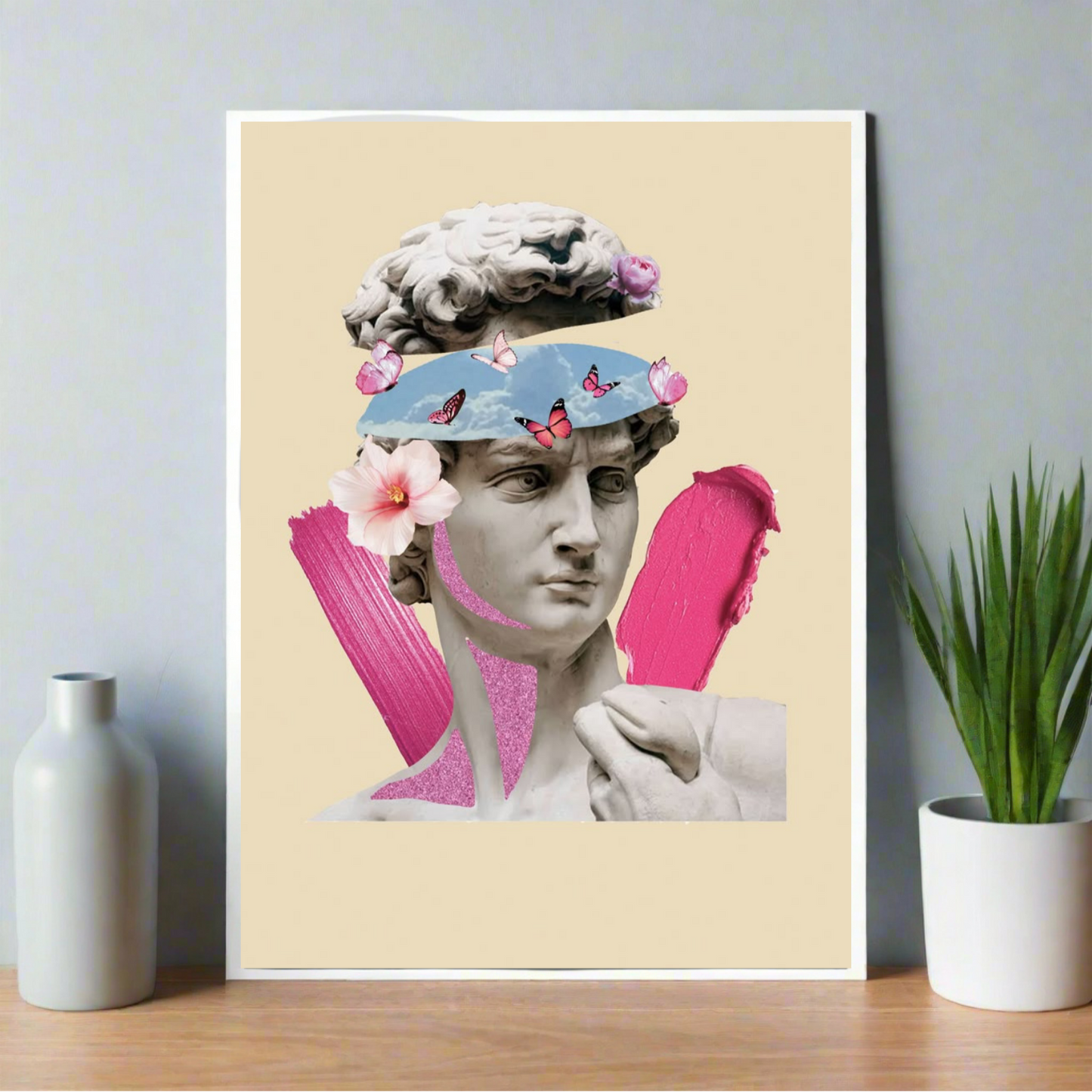 Poster featuring Michelangelo’s David with surreal blue sky eyes, butterflies, flowers, and bold pink paint accents on a beige background.
