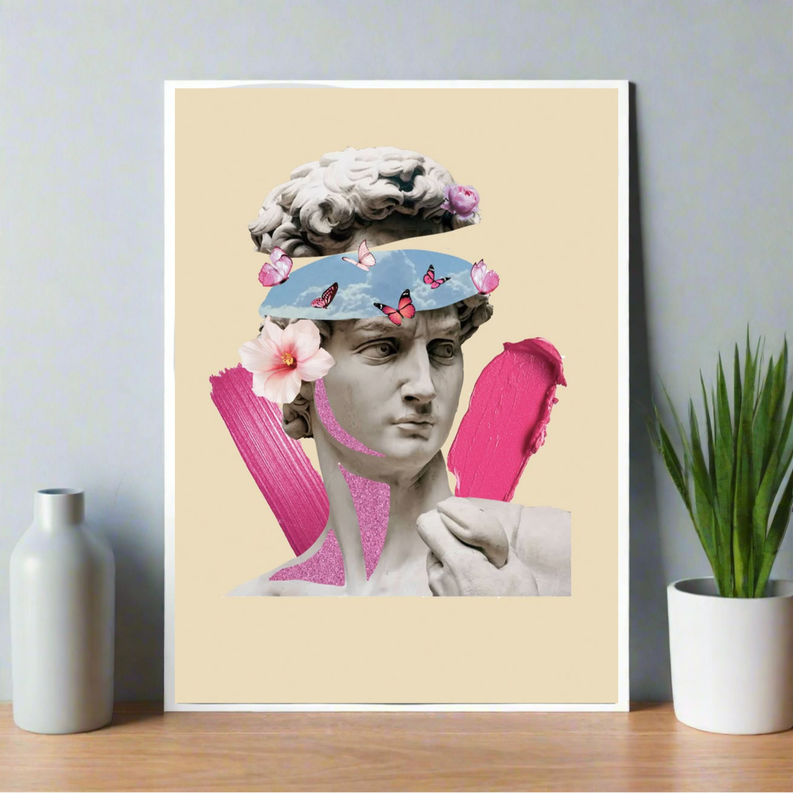 Poster featuring Michelangelo’s David with surreal blue sky eyes, butterflies, flowers, and bold pink paint accents on a beige background.