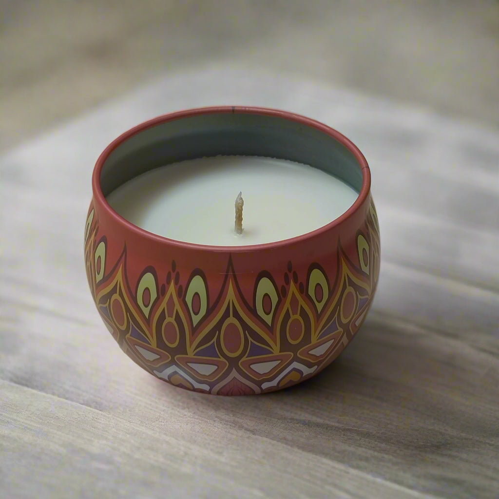 Decorative round scented candle in a terracotta pot with intricate gold and white patterns, scented candles, best scented candles, candles, candle, scented candle, best scented candle